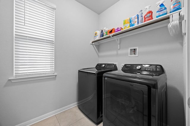 2424 Pecan Island Dr, Leander, TX 78641 - washroom with washing machine and dryer and light tile patterned flooring