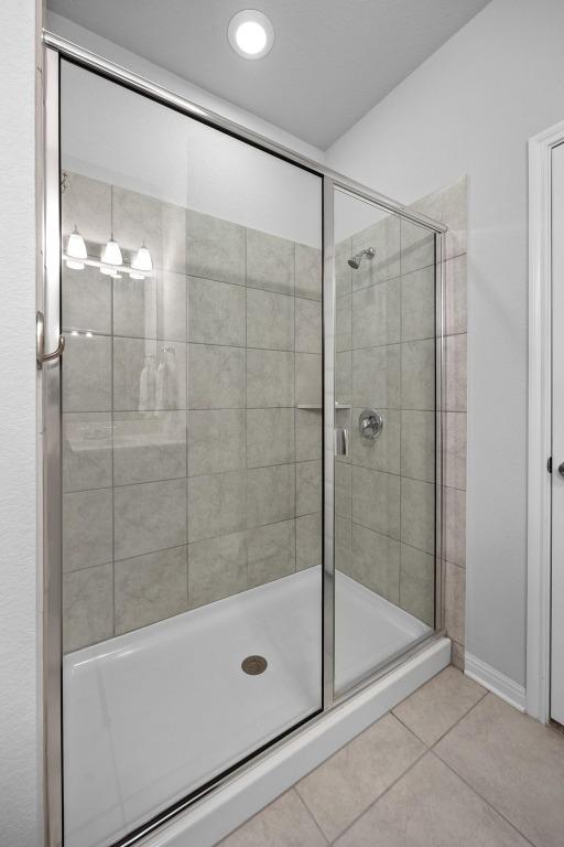 2424 Pecan Island Dr, Leander, TX 78641 - full bath with tile patterned floors and a stall shower