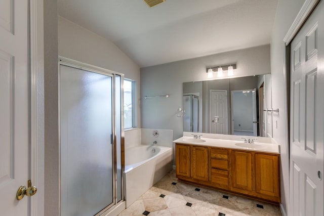 15737 Cadoz Dr, Austin, TX 78728 - full bath featuring vaulted ceiling, a shower stall, a bath, double vanity, and tile patterned flooring