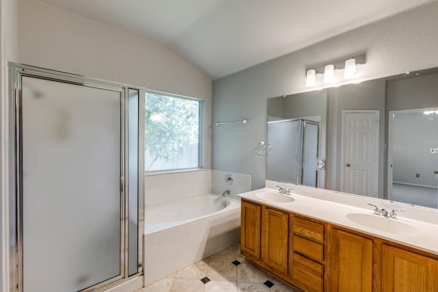 15737 Cadoz Dr, Austin, TX 78728 - full bathroom with a bath, a stall shower, vaulted ceiling, double vanity, and tile patterned flooring