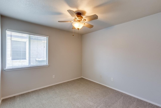 15737 Cadoz Dr, Austin, TX 78728 - carpeted empty room with ceiling fan and baseboards