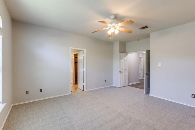 15737 Cadoz Dr, Austin, TX 78728 - unfurnished bedroom with light carpet, connected bathroom, and a ceiling fan