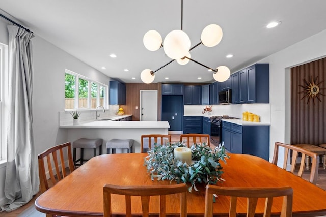 1909 Belford Dr, Austin, TX 78757 - dining room featuring recessed lighting and light wood-style flooring