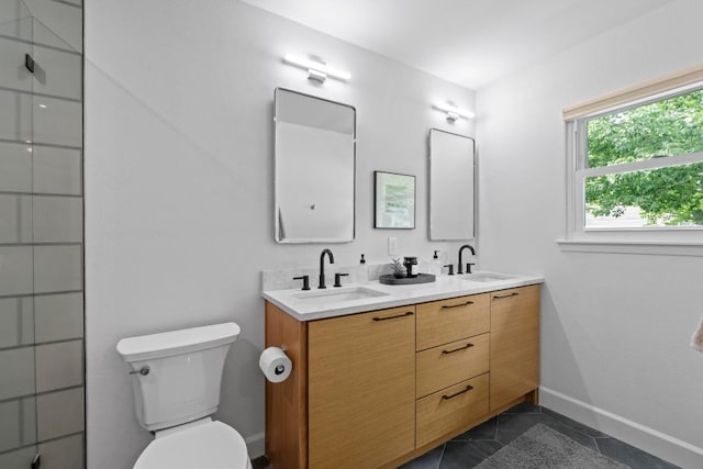 1909 Belford Dr, Austin, TX 78757 - full bath featuring double vanity, an enclosed shower, and tile patterned floors