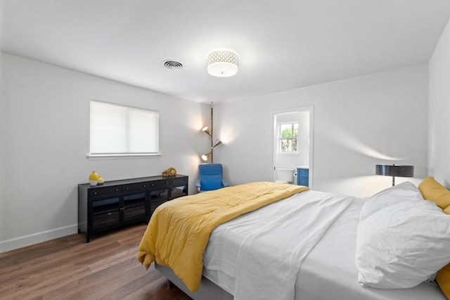 1909 Belford Dr, Austin, TX 78757 - bedroom featuring wood finished floors and baseboards