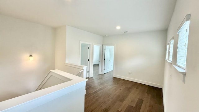 6800 Menchaca Rd Unit 31, Austin, TX 78745 - empty room featuring dark wood-style flooring and recessed lighting