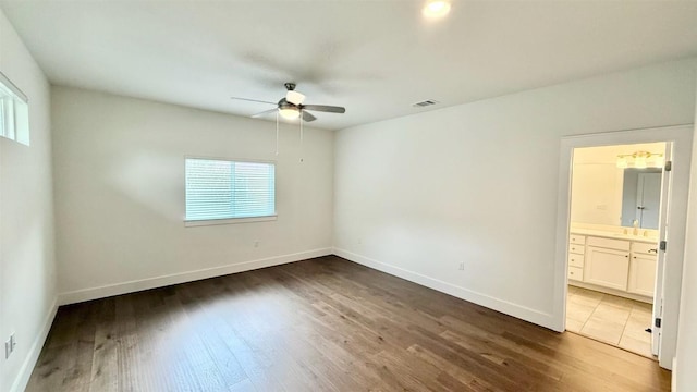 6800 Menchaca Rd Unit 31, Austin, TX 78745 - spare room with ceiling fan and wood finished floors