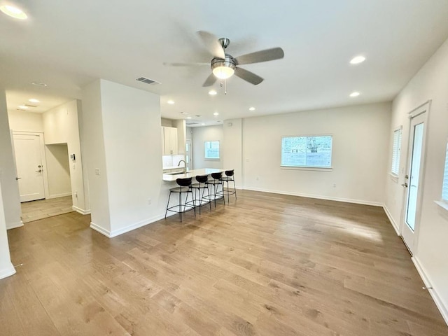 6800 Menchaca Rd Unit 31, Austin, TX 78745 - living area with a ceiling fan, light wood-style floors, and recessed lighting