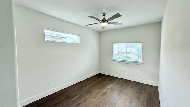 6800 Menchaca Rd Unit 31, Austin, TX 78745 - spare room featuring dark wood-style flooring and ceiling fan