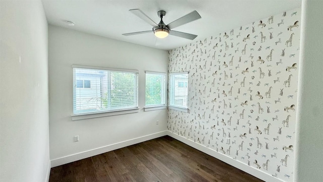 6800 Menchaca Rd Unit 31, Austin, TX 78745 - unfurnished room with plenty of natural light, dark wood-style flooring, a ceiling fan, and wallpapered walls