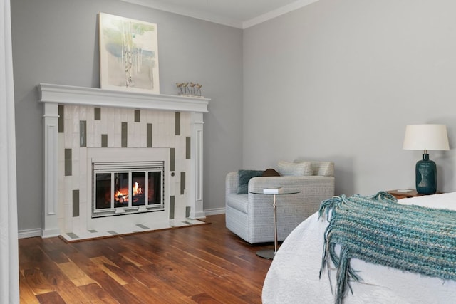5812 Abilene Trl, Austin, TX 78749 - bedroom with crown molding, wood finished floors, and a tiled fireplace
