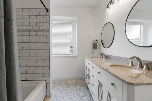 5812 Abilene Trl, Austin, TX 78749 - bathroom featuring double vanity, plenty of natural light, shower / bath combo with shower curtain, and tile patterned floors