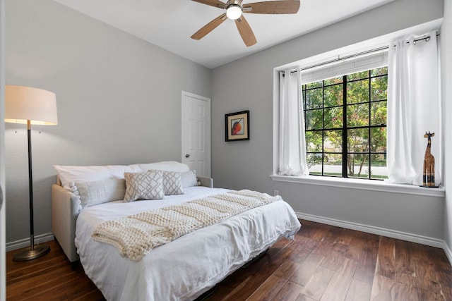 5812 Abilene Trl, Austin, TX 78749 - bedroom with multiple windows, hardwood / wood-style floors, and a ceiling fan