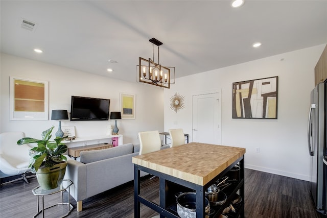 4361 S Congress Ave Unit 126, Austin, TX 78745 - kitchen with freestanding refrigerator, dark wood-style floors, a chandelier, recessed lighting, and hanging light fixtures