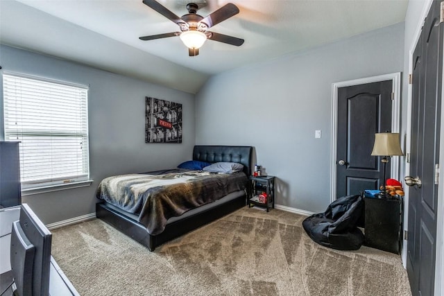 544 Blossom Valley Strm, Buda, TX 78610 - bedroom with carpet, vaulted ceiling, and a ceiling fan