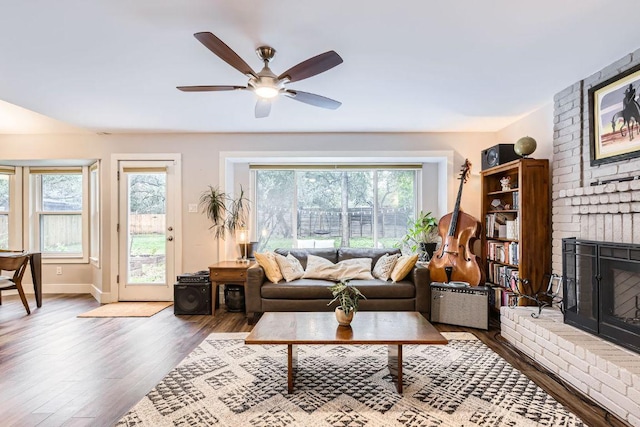 7702 Kincheon Ct, Austin, TX 78749 - living room with a fireplace, wood finished floors, and ceiling fan