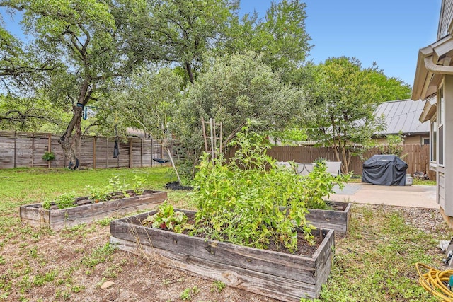 7702 Kincheon Ct, Austin, TX 78749 - fenced backyard with a garden and a patio area