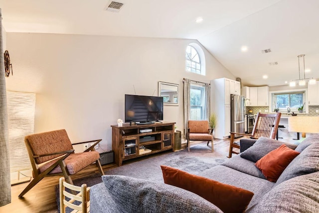 7702 Kincheon Ct, Austin, TX 78749 - living area featuring healthy amount of natural light and high vaulted ceiling