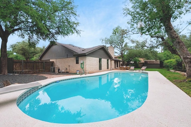 10501 Ronwood Dr, Austin, TX 78750 - view of pool with a diving board and a fenced backyard