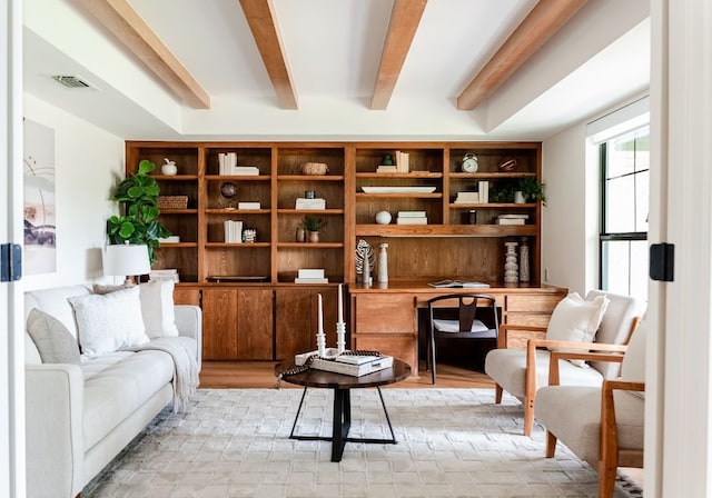 10501 Ronwood Dr, Austin, TX 78750 - sitting room featuring built in desk, beamed ceiling, and light wood-style flooring