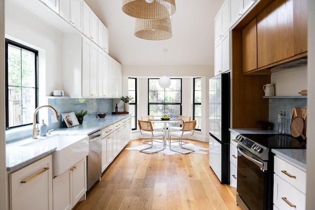 10501 Ronwood Dr, Austin, TX 78750 - kitchen featuring black appliances, open shelves, light wood-style flooring, and tasteful backsplash
