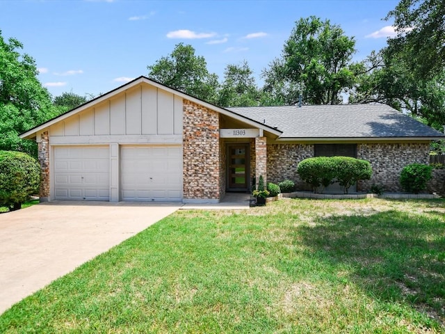 11303 Toledo Dr, Austin, TX 78759 - view of front of property with an attached garage, driveway, a front yard, and board and batten siding