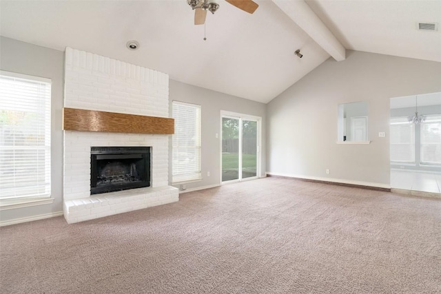 2306 Susan Ln, Leander, TX 78641 - unfurnished living room with a ceiling fan, beamed ceiling, a fireplace, carpet flooring, and plenty of natural light
