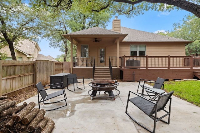 240 Fort Mabry Loop, Georgetown, TX 78628 - rear view of house with an outdoor fire pit, a ceiling fan, a deck, a chimney, and a shingled roof
