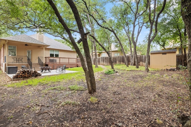 240 Fort Mabry Loop, Georgetown, TX 78628 - fenced backyard with a patio, a shed, ceiling fan, and a wooden deck