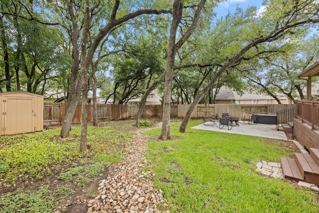240 Fort Mabry Loop, Georgetown, TX 78628 - fenced backyard with a storage unit, a patio, and a fire pit
