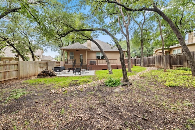 240 Fort Mabry Loop, Georgetown, TX 78628 - rear view of house with a fenced backyard, a patio area, a deck, and a shingled roof