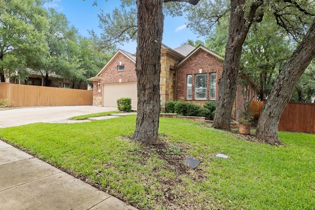 240 Fort Mabry Loop, Georgetown, TX 78628 - traditional-style home featuring concrete driveway, brick siding, stone siding, and a garage