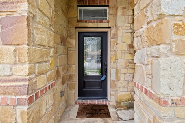 240 Fort Mabry Loop, Georgetown, TX 78628 - doorway to property featuring stone siding
