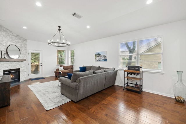 240 Fort Mabry Loop, Georgetown, TX 78628 - living area featuring dark wood finished floors, a chandelier, a fireplace, and recessed lighting