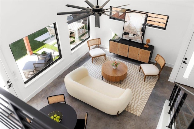 409 W 55th 1/2 St Unit 2, Austin, TX 78751 - living area with concrete floors and a ceiling fan