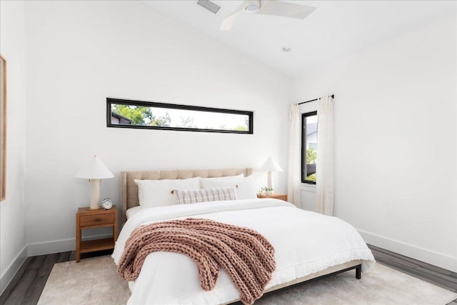 409 W 55th 1/2 St Unit 2, Austin, TX 78751 - bedroom with multiple windows, wood finished floors, a ceiling fan, and lofted ceiling