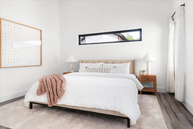 409 W 55th 1/2 St Unit 2, Austin, TX 78751 - bedroom featuring wood finished floors and baseboards