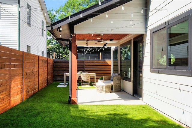 409 W 55th 1/2 St Unit 2, Austin, TX 78751 - fenced backyard featuring a ceiling fan and a patio area