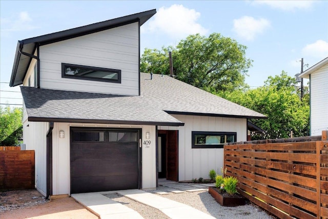 409 W 55th 1/2 St Unit 2, Austin, TX 78751 - contemporary home featuring roof with shingles and board and batten siding