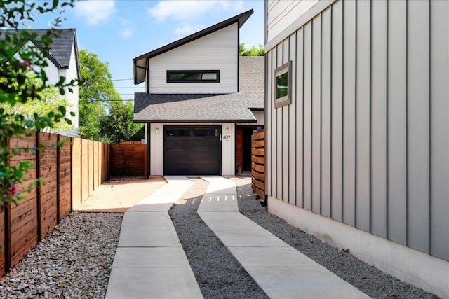 409 W 55th 1/2 St Unit 2, Austin, TX 78751 - view of home's exterior with board and batten siding and a shingled roof