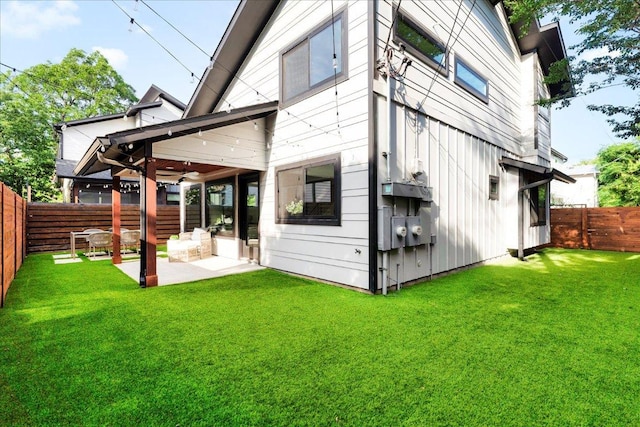 409 W 55th 1/2 St Unit 2, Austin, TX 78751 - rear view of house with a fenced backyard, a patio area, and a ceiling fan