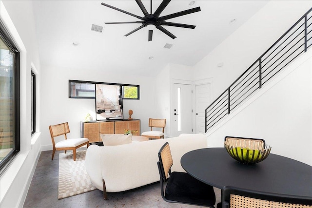 409 W 55th 1/2 St Unit 2, Austin, TX 78751 - living area with stairway, high vaulted ceiling, ceiling fan, and finished concrete floors