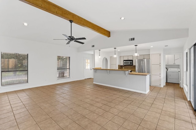 1108 Hi Stirrup Unit 12, Horseshoe Bay, TX 78657 - unfurnished living room with washer / clothes dryer, a ceiling fan, light tile patterned floors, and recessed lighting