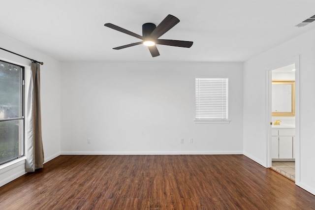 1108 Hi Stirrup Unit 12, Horseshoe Bay, TX 78657 - empty room featuring wood finished floors and a ceiling fan