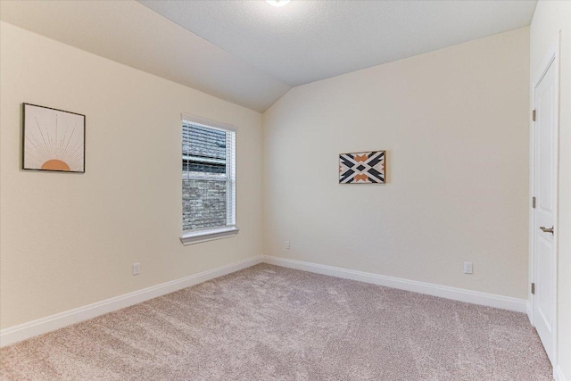 18211 Winnow Way, Pflugerville, TX 78660 - spare room featuring light colored carpet and vaulted ceiling
