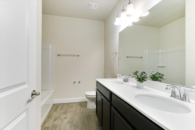 18211 Winnow Way, Pflugerville, TX 78660 - bathroom featuring wood finished floors, double vanity, and shower / bathtub combination
