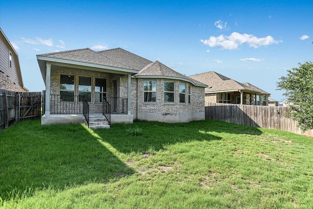 18211 Winnow Way, Pflugerville, TX 78660 - back of house featuring a fenced backyard, a porch, and a shingled roof