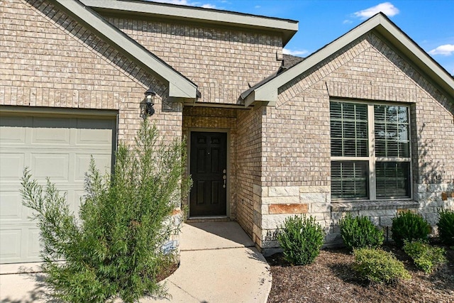 18211 Winnow Way, Pflugerville, TX 78660 - entrance to property with a garage and brick siding