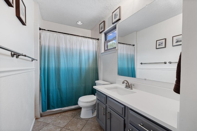 4304 Adelphi Ln, Austin, TX 78727 - bathroom with a textured ceiling, vanity, tile patterned flooring, and a shower with curtain