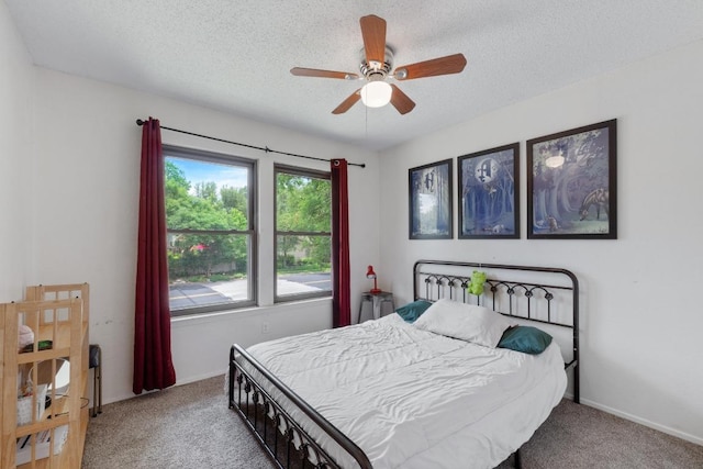 4304 Adelphi Ln, Austin, TX 78727 - carpeted bedroom with a textured ceiling and ceiling fan
